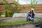 Child and mother gardening in vegetable garden in backyard