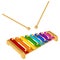 Child musical instrument xylophone with eight colored metal plates