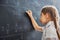 Child near the blackboard