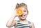 Child with orange isolated on white. Caucasian girl smiling portrait with fruit.Summer concept beautiful kid