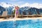 Child in outdoor swimming pool of alpine resort