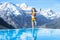 Child in outdoor swimming pool of alpine resort