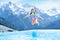 Child in outdoor swimming pool of alpine resort