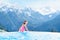 Child in outdoor swimming pool of alpine resort