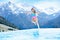 Child in outdoor swimming pool of alpine resort