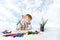 Child painting with color brush, drawing tools, creative kid