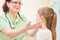 Child pediatrician. Female doctor palpating for diagnosing a disease