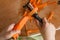 Child peeling the carrot for cook