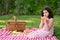 Child peeling orange at picnic