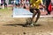 child performs the long jump