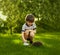 Child with pet. Boy feeding hedgehog and pours milk into a bowl.