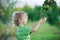 Child picking an apple