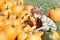 Child Picking a Pumpkin