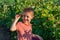 Child picking raspberry. Kids pick fresh fruit on organic raspberries farm. Toddler kid eating ripe healthy raspberry.