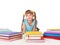 Child with pile of books lying on floor.