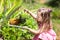 Child on pineapple fruit plantation.