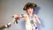 A child in a pirate costume is played with pirate dolls