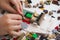 Child placing a Lego brick on to a lego plate