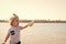 Child play with seashell on sunny seascape. Little boy with shell on sea beach. Freedom, discovery and adventure. Summer