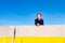 A child play on some construction barriers running into danger  isolated blue background