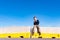 A child play on some construction barriers running into danger  isolated blue background