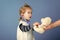 Child play veterinarian with teddy bear in mothers hand