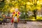 Child on playground in autumn. Kids in fall.