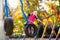 Child on playground in autumn. Kids in fall.