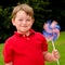 Child playing with American flag pinwheel