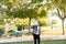 Child Playing Badminton in Park, Shuttlecock Flying Towards Face in Conceptual Shot, Green Trees and Leaves in