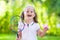 Child playing badminton or tennis outdoor in summer