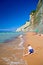 Child playing on the beach at Corfu island