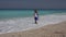 Child Playing on Beach, Kid Running in Sea Waves, Girl Walking in Sunset