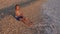 Child Playing on Beach, Kid at Sunset, Girl Throwing Pebbles in Sea Water