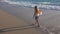 Child Playing on Beach at Sunset, Happy Kid Walking in Sea Waves Girl on Seaside