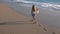 Child Playing on Beach at Sunset, Happy Kid Walking in Sea Waves Girl on Seaside