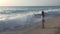 Child Playing on Beach in Sunset, Kid Watching Sea Waves, Girl View at Sundown