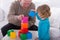 Child playing with color cubes