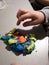 Child playing with colorful dough