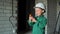 A child is playing construction worker at a construction site