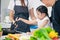 Child playing cook food with father and mother at home kitchen. Asian family happiness moment together