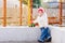 child playing excavator on the street