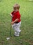 Child playing golf