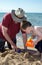 Child playing with grandpa on a Indiana beach