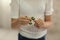 Child playing with green fidget spinner closeup in bright room