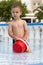 Child playing in hotel swimming pool