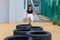 Child Playing Jumping Tires in Playground