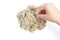 Child playing with kinetic sand. Hand of the child in the sand c