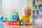 Child playing with magnetic building blocks