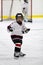 Child playing minor hockey in the arena